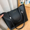 Fashionable black leather tote bag with golden Forever Young logo and adjustable straps - Black