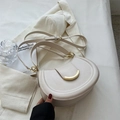 Chic cream leather saddle bag with gold metal buckle and adjustable strap in retro style - White