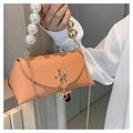Peach orange leather handbag with large pearl handle and golden chain strap - Orange