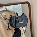Elegant black crescent saddle bag in smooth leather with gold hardware and adjustable strap - Black