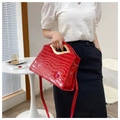 Bright red crocodile texture tote bag with gold geometric handle and lip detail - Red