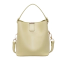 Elegant light green bucket bag in smooth leather with gold hardware and top handle - Yellow