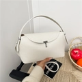 Minimalist warm white pebbled leather handbag with metal lock and top handle - White