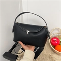 Classic black lychee pattern leather handbag with silver T-buckle and crossbody strap - Black