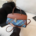 Contrast woven texture handbag with silver twist lock and colorful knit pattern - Blue