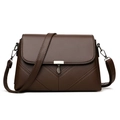 Brown lychee grain leather crossbody bag with flap and metal leaf pendant detail - Brown