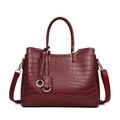 Elegant burgundy crocodile embossed tote bag with gold hardware and dual handles - Burgundy