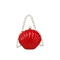 Translucent red shell-shaped acrylic handbag featuring elegant faux pearl handle chain - Transparent Red