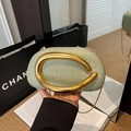 Light green tweed crossbody bag with unique gold curved handle and chain strap - Green