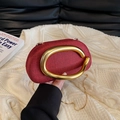 Vintage wine red oval evening bag with woven texture and gold C-shaped metal handle - Red
