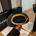 Elegant black glitter evening clutch with a polished gold circular handle and chain - Black