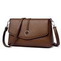 Minimalist brown lychee pattern leather crossbody bag with silver circular metal buckle - Brown