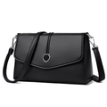 Sac bandoulière en cuir grainé noir avec boucle florale argentée et bandoulière fine - Noir