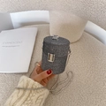Silver rhinestone cylinder evening bag with chain strap on a soft bouclé surface - Gray