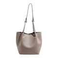 Minimalist grey lychee textured bucket bag with long shoulder strap in variant view - Gray