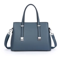 Minimalist grey-blue tote bag with twin handles and silver metal accents on white background - Blue