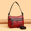 Bolso bandolera de cuero granulado rojo con correa marrón y logotipo de canguro - Burdeos