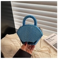 Blue rhinestone acrylic evening bag with gold chain and handle in a lifestyle setting - Blue