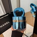 Mirror blue heart-handle cylindrical evening bag with gold chain strap in a luxury setting - Cylindrical Shape / Blue