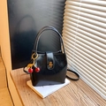 Minimalist black bucket bag in shiny leather featuring cherry charm and gold clasp - Without Pendant / Black