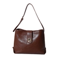Brown vintage faux leather tote bag with glossy finish and gold buckle on white background - Brown