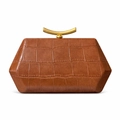 Detail of brown crocodile pattern handbag with elegant golden crescent metal handle - Tan