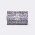 Detailed view of silver striped acrylic clutch bag with metallic foil texture and layering - Silver