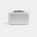 Close-up of a silver rectangle clutch with sparkling rhinestones and a bow clasp - White