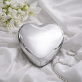 Sleek silver heart-shaped metal evening clutch bag on white satin with floral accents - Silver