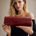 Chic burgundy faux crocodile baguette bag with gold metal clasp for elegant evening parties - Burgundy