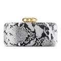 Detail of elegant snake pattern clutch with gold interlocking triple-ring metal clasp - White