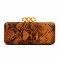 Macro detail of brown python embossed texture and chunky gold chain link closure - Orange