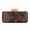 Detail of snake-embossed clutch bag featuring three decorative gold chain top clasps - Chestnut