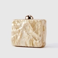 Detail of marble texture acrylic clutch bag with golden metallic top clasp and glossy finish - Khaki