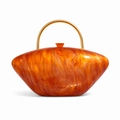 Macro detail of orange marble acrylic evening bag with a semi-circular gold metal handle - Orange Red Marble