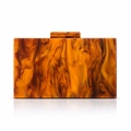Detailed macro view of amber marble acrylic clutch bag with artistic resin texture - Orange