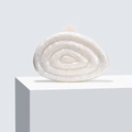 Detailed view of white acrylic clutch with a 3D shell pattern and pearlescent texture - Milky White