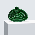 Macro detail of dark green malachite acrylic evening bag with wave texture - Green