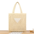 Chic cream woven tote bag with triangular patch and hollow diamond mesh for beach vacations - Beige