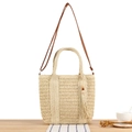 Handwoven straw tote bag in beige with dark brown leather strap and wood bead tassel - Beige