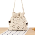 Handmade beige crochet bucket bag with woven straps and decorative brown wooden beads - Beige