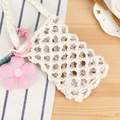 Handmade cream woven cotton rope phone bag with a pink floral charm and rustic styling - White + Pink