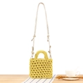 Handmade hollow crochet woven bag in bright yellow with round handle and crossbody strap - Ginger Yellow