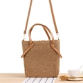 Handwoven straw tote bag in light brown with dual handles and leather shoulder strap - Camel
