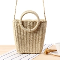Straw woven bucket bag in beige with round handles and strap for summer beach vacation - Beige