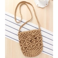 Handmade khaki woven crossbody bag with wooden bead drawstring on wooden surface - Camel