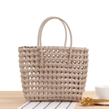 Handcrafted beige PVC woven handbag in a stylish tote design for beach and shopping - Gray