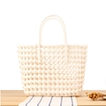 Chic beige PVC woven tote bag with durable hollow structure for beach or grocery shopping - Cream