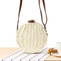Round straw woven crossbody bag in cream white with brown leather strap detail - White