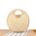 Handcrafted beige round straw tote bag with brown leather clasp on a wooden table - Beige (Upgraded Handle)